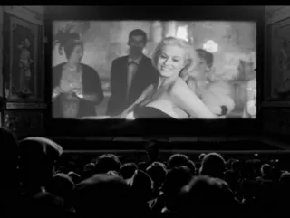 A screenshot of a classic film being shown in cinema in black and white.