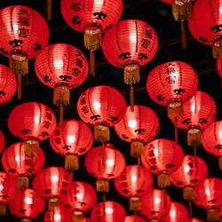Red lanterns with Chinese characters written upon them hang in row upon row.