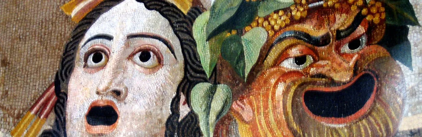 A Roman mosaic depicting two theatrical masks: a pale, wide-eyed tragedy mask on the left and a grinning, bearded comedy mask adorned with ivy leaves on the right.